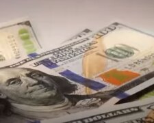 Доллары. Фото: скриншот YouTube-видео